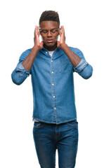 Poster - Young african american man over isolated background with hand on head for pain in head because stress. Suffering migraine.