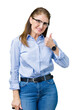 © Krakenimages.com - Beautiful middle age mature business woman wearing glasses over isolated background doing happy thumbs up gesture with hand. Approving expression looking at the camera showing success.