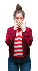 Sticker - Beautiful brunette curly hair young girl wearing a jacket over isolated background shocked covering mouth with hands for mistake. Secret concept.