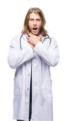 Poster - Young handsome doctor man with long hair over isolated background shouting and suffocate because painful strangle. Health problem. Asphyxiate and suicide concept.