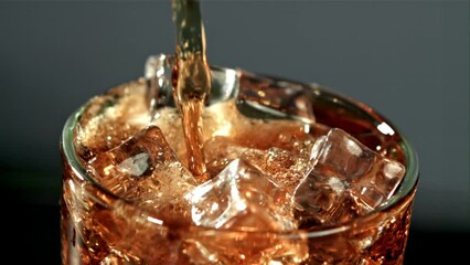 Canvas Print - Cola is poured into a glass with ice. Filmed is slow motion 1000 fps. High quality FullHD footage