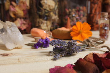 Dried Lavender and Rose Petals on Table With Incense Cones and Crystals