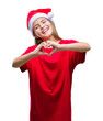 © Krakenimages.com - Young beautiful girl wearing christmas hat over isolated background smiling in love showing heart symbol and shape with hands. Romantic concept.