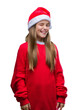 © Krakenimages.com - Young beautiful girl wearing christmas hat over isolated background winking looking at the camera with sexy expression, cheerful and happy face.