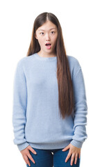 Poster - Young Chinese woman over isolated background afraid and shocked with surprise expression, fear and excited face.