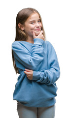 Wall Mural - Young beautiful girl wearing winter sweater over isolated background looking confident at the camera with smile with crossed arms and hand raised on chin. Thinking positive.