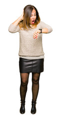 Sticker - Beautiful middle age woman wearing fashion sweater Looking at the watch time worried, afraid of getting late