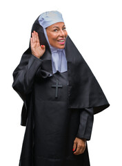 Sticker - Middle age senior christian catholic nun woman over isolated background smiling with hand over ear listening an hearing to rumor or gossip. Deafness concept.