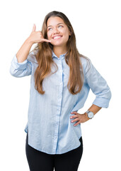 Sticker - Young beautiful brunette business woman over isolated background smiling doing phone gesture with hand and fingers like talking on the telephone. Communicating concepts.