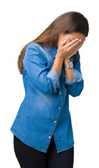 Sticker - Young beautiful brunette woman wearing blue denim shirt over isolated background with sad expression covering face with hands while crying. Depression concept.