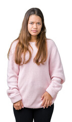 Sticker - Young beautiful brunette woman wearing pink winter sweater over isolated background skeptic and nervous, frowning upset because of problem. Negative person.