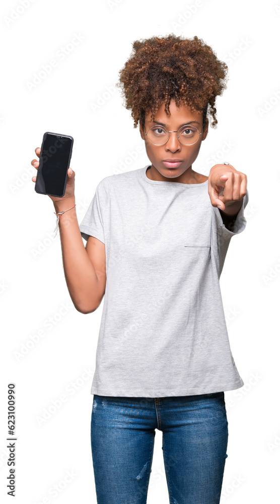Young african american woman showing smartphone screen over isolated ...