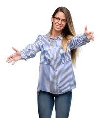 Sticker - Beautiful young woman wearing elegant shirt and glasses looking at the camera smiling with open arms for hug. Cheerful expression embracing happiness.