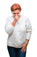 Wall Mural - Atrractive senior caucasian redhead woman wearing winter sweater over isolated background feeling unwell and coughing as symptom for cold or bronchitis. Healthcare concept.