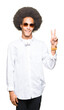 © Krakenimages.com - Young african american man with afro hair wearing sunglasses and headphones smiling with happy face winking at the camera doing victory sign. Number two.