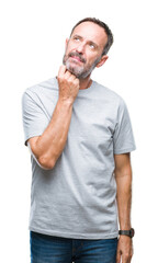 Wall Mural - Middle age senior hoary man over isolated background with hand on chin thinking about question, pensive expression. Smiling with thoughtful face. Doubt concept.