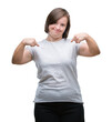 © Krakenimages.com - Young adult woman with down syndrome over isolated background looking confident with smile on face, pointing oneself with fingers proud and happy.