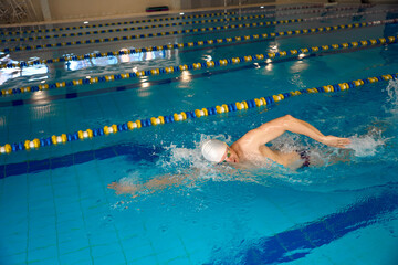 Male doing crawl exercise on the water