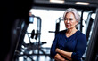 © Flash - healthy middle aged lady woman in sport wear at gym, generative AI