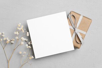 Wall Mural - Square card mockup with gift box and dry gypsophila flowers