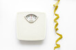 © 279photo - White floor weight scales with measuring tape. Body weight control and slimming concept