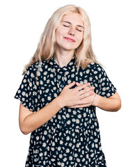 Wall Mural - Young caucasian woman together smiling with hands on chest with closed eyes and grateful gesture on face. health concept.