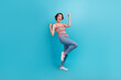 Full length portrait of overjoyed glad person raise fists luck triumph accomplishment isolated on blue color background