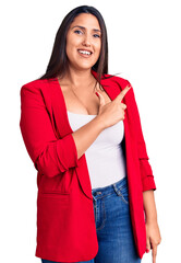 Poster - Young beautiful brunette woman wearing elegant clothes cheerful with a smile of face pointing with hand and finger up to the side with happy and natural expression on face