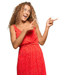 Poster - Beautiful caucasian teenager girl wearing summer dress smiling and looking at the camera pointing with two hands and fingers to the side.