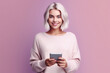 © VK Studio - Smiling modern young blonde teen girl holding tablet, advertising trendy mobile apps. Generative AI
