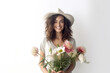 © VK Studio - Smiling pretty female gardener in hat holds flowers bouquet. Natural woman beauty. Generative AI