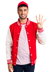 Poster - Young hispanic man wearing baseball uniform showing and pointing up with fingers number four while smiling confident and happy.