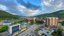 Aerial View Of The City Of Gorno-Altaysk, Russia. Blue Sky, White Clouds And Green Hills.