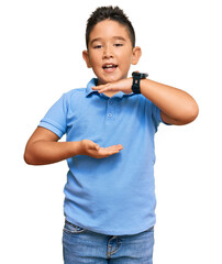 Sticker - Little boy hispanic kid wearing casual clothes gesturing with hands showing big and large size sign, measure symbol. smiling looking at the camera. measuring concept.