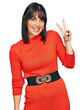 © Krakenimages.com - Young hispanic woman wearing casual clothes smiling with happy face winking at the camera doing victory sign. number two.
