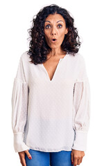 Sticker - Middle age beautiful woman wearing casual sweater afraid and shocked with surprise expression, fear and excited face.