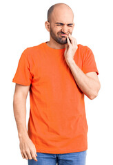 Sticker - Young handsome man wering casual t shirt touching mouth with hand with painful expression because of toothache or dental illness on teeth. dentist