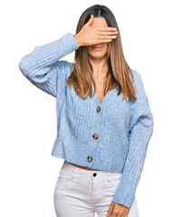 Wall Mural - Young woman wearing casual clothes covering eyes with hand, looking serious and sad. sightless, hiding and rejection concept