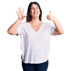 Sticker - Young beautiful brunette woman wearing casual t-shirt showing and pointing up with fingers number six while smiling confident and happy.