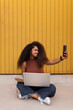 © ADDICTIVE STOCK - Smiling ethnic female freelancer taking selfie on smartphone