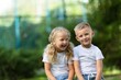 © BillionPhotos.com - Two smile happy schoolchildren in park about school.