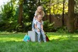 © BillionPhotos.com - Two smile happy schoolchildren in park about school.