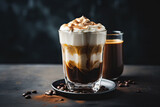 caffee latte layered with whipped cream on gray stone