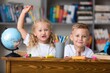 © BillionPhotos.com - Children with globe, interesting geography  learning.