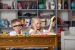 © BillionPhotos.com - School boy dreaming with alarm clock in classroom