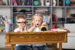 © BillionPhotos.com - School boy dreaming with alarm clock in classroom