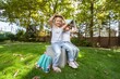 © BillionPhotos.com - Schoolchilds hugging in park. Back to school concept.