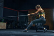 © USM Photography - Full-length shot of Power woman functional training with black rope at a gym
