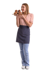 Sticker - Female baker with tray of tasty cupcakes on white background