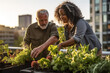© t.sableaux - Middle age couple working in the roof garden in the modern big city